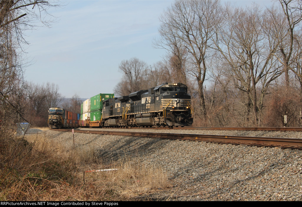 NS 1128 takes train 21E east while another train sits on the siding